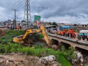 Zoomlion backs national sanitation drive with massive fleet rollout. An excavator clearing thick silt from a large, choked storm drain to prevent flooding.